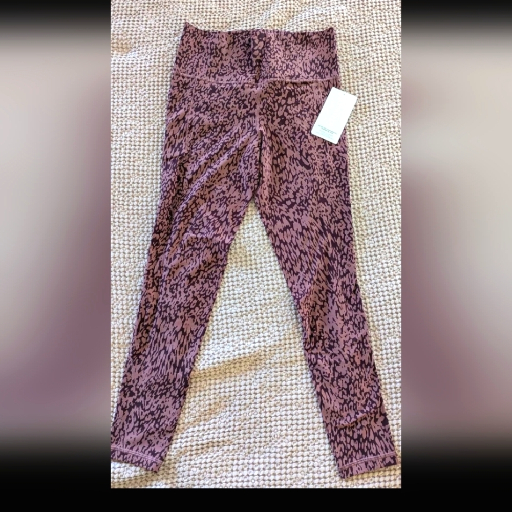 Athleta pink animal print Salutation Stash leggings sz medium tall